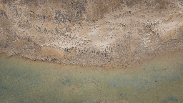 Aerial view of the turquoise blue water and intricate sand patterns along the coastline in Denham Western Australia Australia. Aerial view of the turquoise blue water and intricate sand patterns along the coastline in Denham Western Australia Australia.