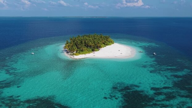 Aerial view of a tropical island and coral reefs Maldives. Aerial view of a tropical island and coral reefs Maldives.