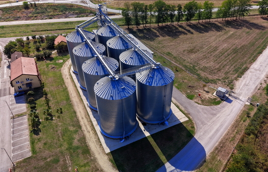 Aerial view of the storage silo Bavaniste with its metallic cylindrical structures and connecting pipes situated in a rural landscape in Bavaniste Vojvodina Serbia.