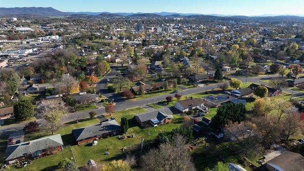 Aerial view of a residential neighborhood with autumn foliage houses and streets in Harrisonburg Virginia United States.
