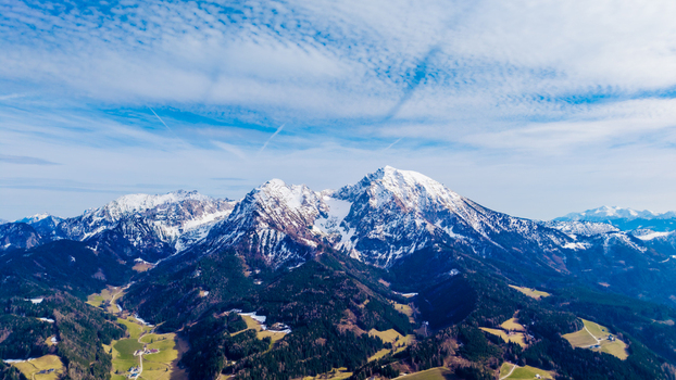 Aerial view of snow capped peaks pierce the sky contrasting with the deep green valleys a stunning display of nature s beauty Windischgarsten Upper Austria Austria. Aerial view of snow capped peaks pierce the sky contrasting with the deep green valleys a stunning display of nature s beauty Windischgarsten Upper Austria Austria.