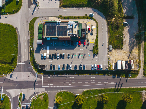 Aerial view of Logistikzentrum Allhaming rooftop solar panels parking lot with cars and road infrastructure Allhaming Oberosterreich Austria. Aerial view of Logistikzentrum Allhaming rooftop solar panels parking lot with cars and road infrastructure Allhaming Oberosterreich Austria.
