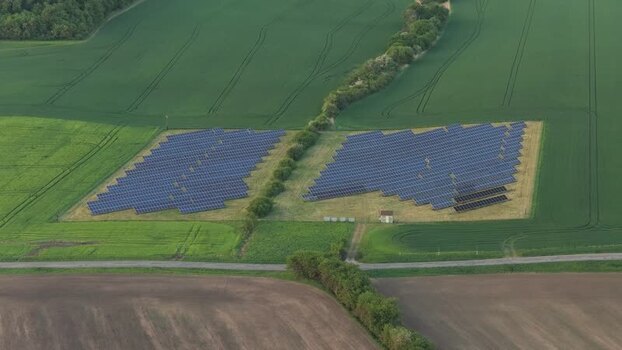 Aerial view of a solar farm in green fields Czechia. Aerial view of a solar farm in green fields Czechia.