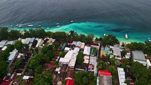 Aerial view of coastal village and turquoise waters Indonesia.