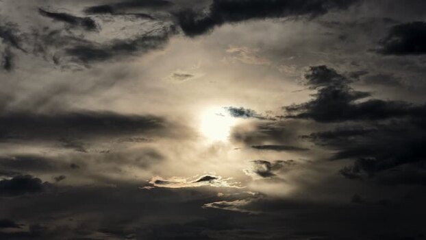 Aerial view of sun shining through thick clouds in United States.