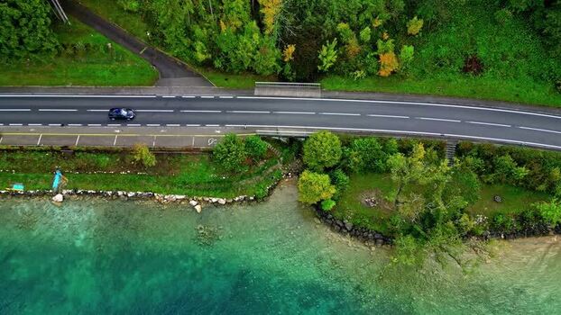 Aerial view of Attersee lake shoreline and road Austria.