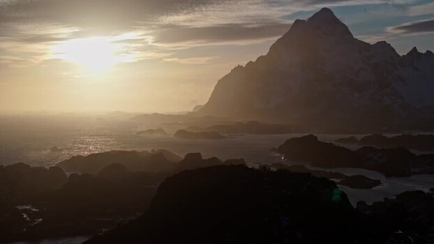 Aerial view of Lofoten mountains at sunset in Norway.
