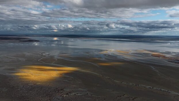 Aerial view of the vast salt flats and dramatic clouds Kazakhstan. Aerial view of the vast salt flats and dramatic clouds Kazakhstan.