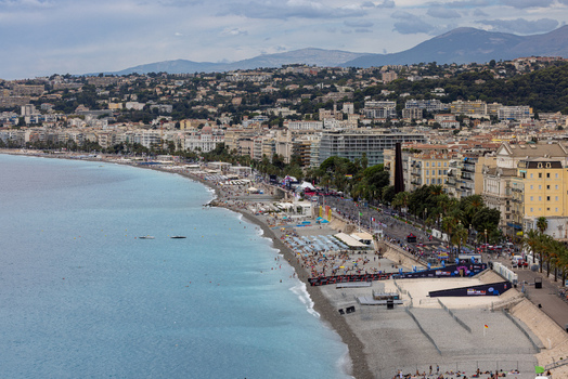 Aerial view of the Promenade des Anglais and the Mediterranean coastline featuring the pebble beach turquoise water and urban architecture Nice Provence Alpes Cote d Azur France. Aerial view of the Promenade des Anglais and the Mediterranean coastline featuring the pebble beach turquoise water and urban architecture Nice Provence Alpes Cote d Azur France.