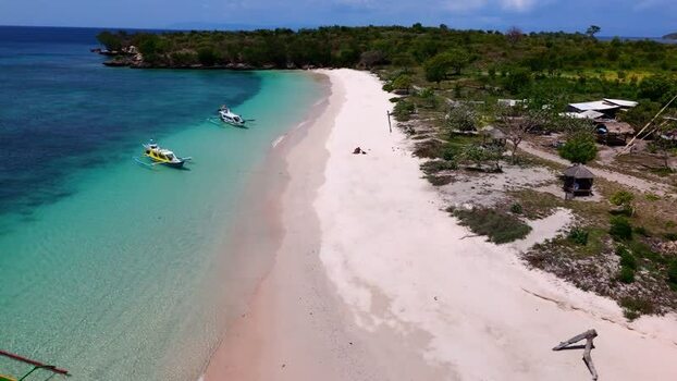 Aerial view of Pink Beach with boats and turquoise water Indonesia. Aerial view of Pink Beach with boats and turquoise water Indonesia.