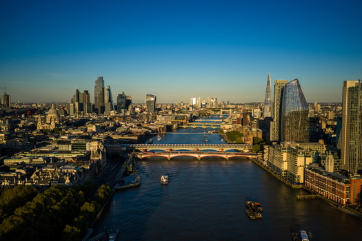 Aerial view of Blackfriars Bridge spanning the River Thames with the city skyline The Shard and St. Paul s Cathedral under a clear blue sky in London Greater London United Kingdom. Aerial view of Blackfriars Bridge spanning the River Thames with the city skyline The Shard and St. Paul s Cathedral under a clear blue sky in London Greater London United Kingdom.