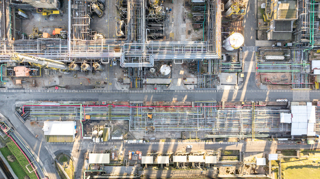 Aerial view of the Capuava Petrochemical Complex featuring intricate networks of industrial pipes storage tanks and processing units in Santo Andre State of Sao Paulo Brazil.