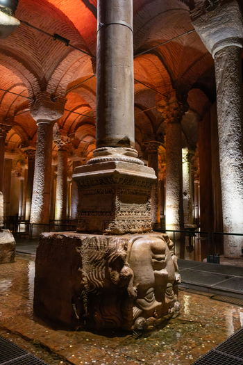 Fatih Istanbul Turkiye 26 July 2026 View of the Medusa head column base in the historic Basilica Cistern with illuminated stone columns and vaulted ceilings.