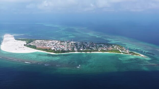 Aerial view of Makunudhoo island and turquoise lagoon Maldives. Aerial view of Makunudhoo island and turquoise lagoon Maldives.