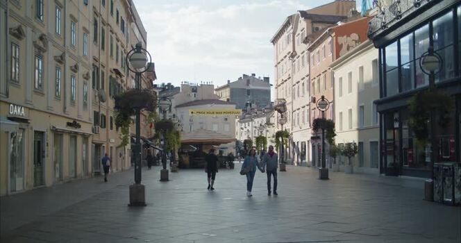 View of people walking along the historic Korzo street in Croatia.