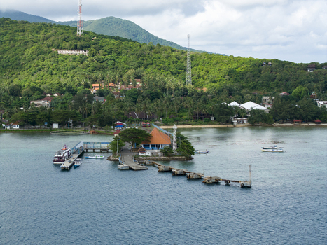 Aerial view of the Karimunjawa ferry harbour where the azure waters meet the verdant coastline Karimunjawa Jawa Tengah Indonesia. Aerial view of the Karimunjawa ferry harbour where the azure waters meet the verdant coastline Karimunjawa Jawa Tengah Indonesia.