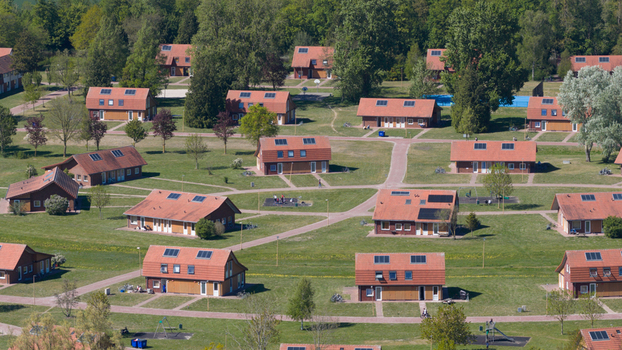 Drone view of AZC Luttelgeest in the Netherlands showing a reception centre for asylum seekers temporary housing community facilities and social infrastructure. Drone view of AZC Luttelgeest in the Netherlands showing a reception centre for asylum seekers temporary housing community facilities and social infrastructure.
