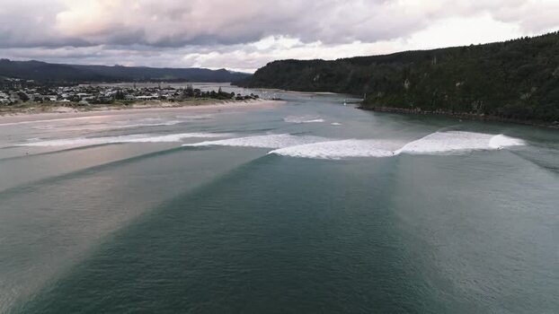 Aerial view of surfing waves in Whangamata New Zealand. Aerial view of surfing waves in Whangamata New Zealand.