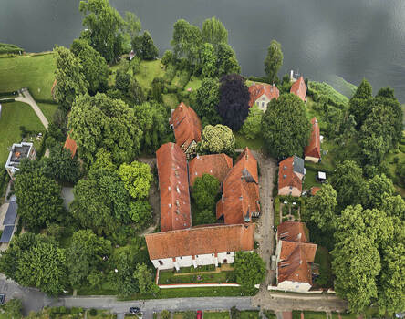 Schleswig Germany 01 July 2026 Aerial view of St Johannis kloster a historic monastery with red tiled roofs and lush green gardens situated along the Schlei inlet.
