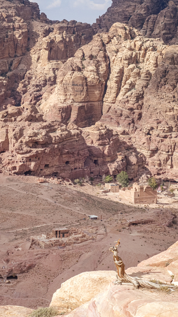 View of the ancient rock cut architecture and desert landscape of Petra near the historic town of Wadi Musa Ma an Governorate Jordan. View of the ancient rock cut architecture and desert landscape of Petra near the historic town of Wadi Musa Ma an Governorate Jordan.