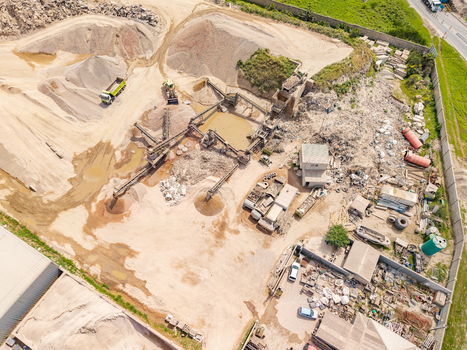 Aerial view of the sand and gravel quarry in Philippi with industrial processing equipment conveyor belts and piles of sand in Cape Town Western Cape South Africa.