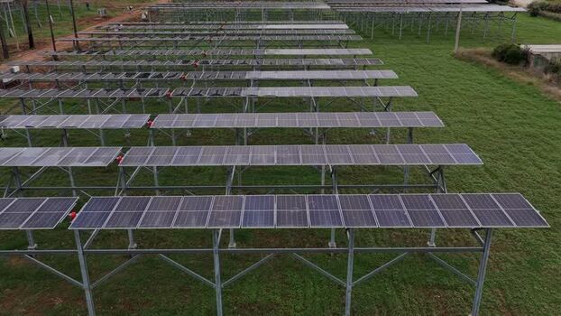 Aerial view of solar panels in a field in Terrasini Italy.