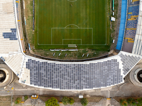 Aerial view of Stadio Riviera delle Palme with solar panels on the roof green football pitch and palm trees in San Benedetto del Tronto Marche Italy.