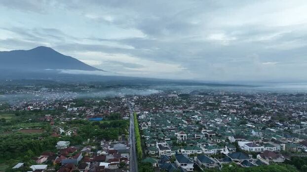 Aerial view of Purwokerto city and Mount Slamet Indonesia. Aerial view of Purwokerto city and Mount Slamet Indonesia.