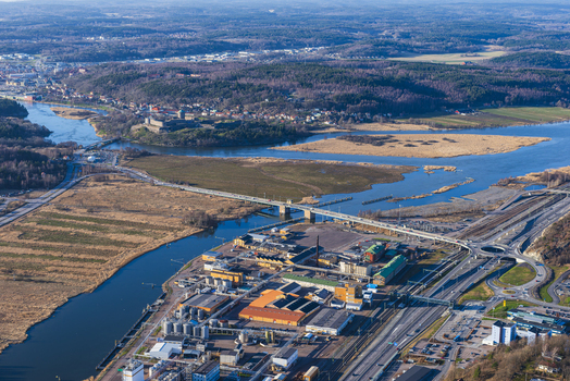 Aerial view of Bohus Fortress overlooking the Gota alv river with industrial facilities a bridge and forest landscapes in Ale Vastra Gotaland County Sweden. Aerial view of Bohus Fortress overlooking the Gota alv river with industrial facilities a bridge and forest landscapes in Ale Vastra Gotaland County Sweden.