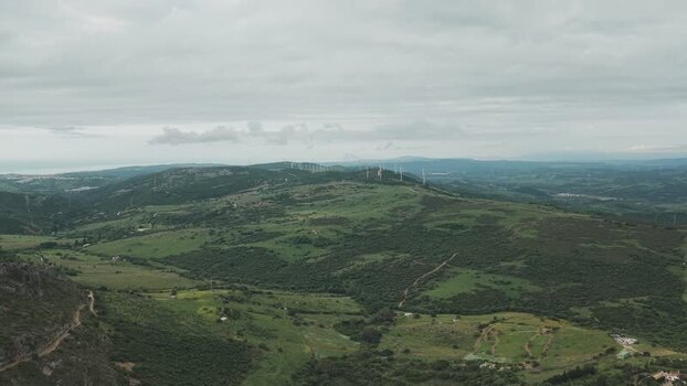 Aerial view of wind turbines on green hills Spain. Aerial view of wind turbines on green hills Spain.