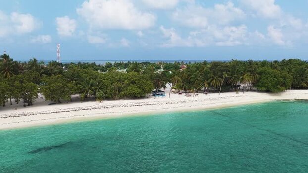 Aerial view of tropical beach and palm trees on Makunudhoo Maldives. Aerial view of tropical beach and palm trees on Makunudhoo Maldives.