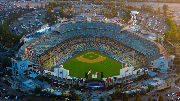Aerial view of Dodger Stadium bathed in golden light a vibrant green field contrasting with the stadium s cool concrete Los Angeles California United States. Aerial view of Dodger Stadium bathed in golden light a vibrant green field contrasting with the stadium s cool concrete Los Angeles California United States.