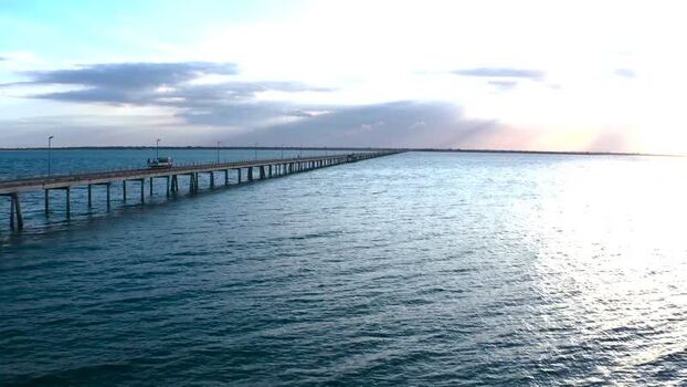 Aerial view of pier stretching into the ocean Mozambique.