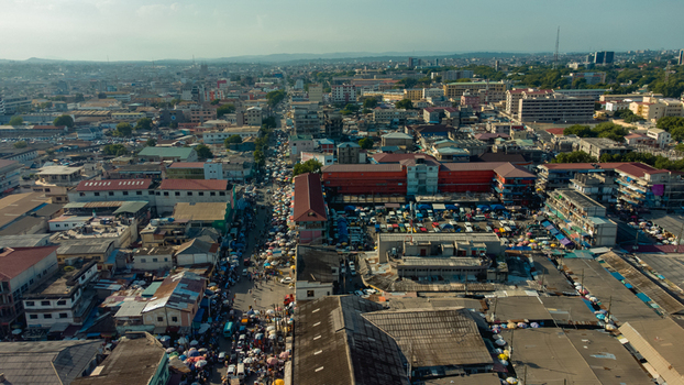 Accra Greater Accra Region 26 May 2023 Aerial view of the dense urban market area with bustling streets colorful stalls and surrounding commercial buildings. Accra Greater Accra Region 26 May 2023 Aerial view of the dense urban market area with bustling streets colorful stalls and surrounding commercial buildings.