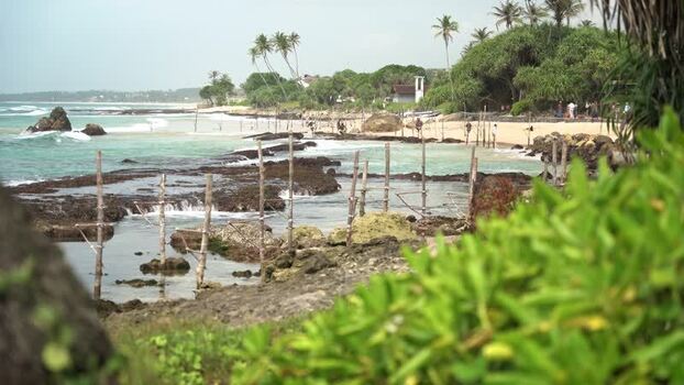 View of stilt fishing poles in the ocean at Koggala Sri Lanka.
