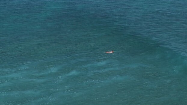 Aerial view of a small board in the turquoise ocean Maldives. Aerial view of a small board in the turquoise ocean Maldives.