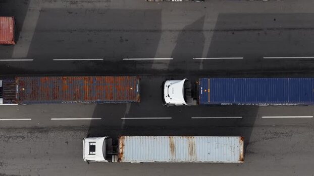 Aerial view of trucks with shipping containers Portugal.