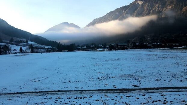 Aerial view of snowy valley and houses France.