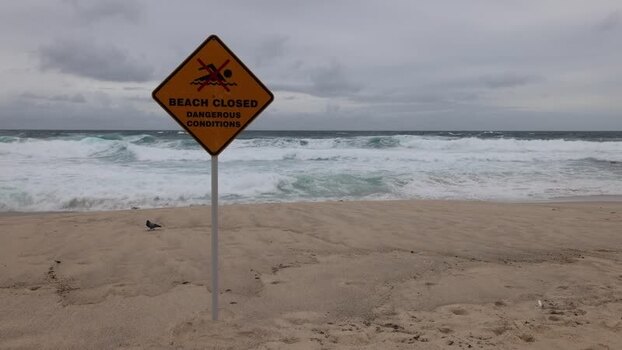 View of beach closed sign at Bondi Beach Australia.