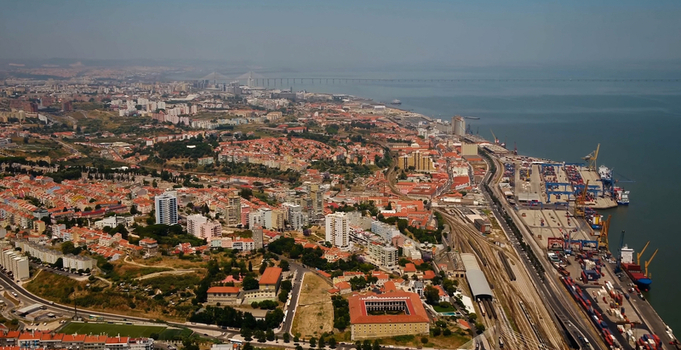Aerial view of the Port of Lisbon with shipping containers cranes and the surrounding urban landscape Lisboa Lisboa Portugal. Aerial view of the Port of Lisbon with shipping containers cranes and the surrounding urban landscape Lisboa Lisboa Portugal.