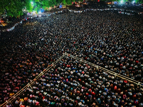 Dhaka Bangladesh 20 July 2026 Aerial view of a massive crowd gathered at Mohsin Hall Playground at night with people standing closely together under artificial lighting. Dhaka Bangladesh 20 July 2026 Aerial view of a massive crowd gathered at Mohsin Hall Playground at night with people standing closely together under artificial lighting.
