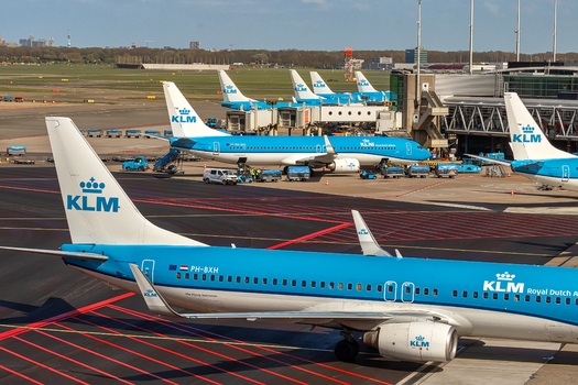Schiphol Netherlands 16 April 2026 View of KLM Royal Dutch Airlines airplanes parked at the terminal gates with ground support equipment and service vehicles on a sunny day. Schiphol Netherlands 16 April 2026 View of KLM Royal Dutch Airlines airplanes parked at the terminal gates with ground support equipment and service vehicles on a sunny day.