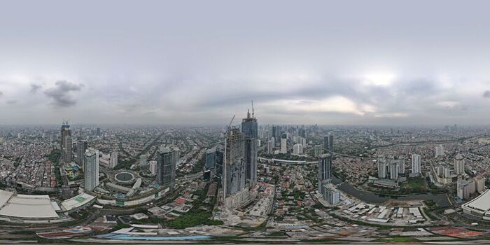 Aerial view of Jakarta Pusat skyline featuring modern skyscrapers under construction dense urban residential areas and winding roads in Kecamatan Menteng Daerah Khusus Ibukota Indonesia. Aerial view of Jakarta Pusat skyline featuring modern skyscrapers under construction dense urban residential areas and winding roads in Kecamatan Menteng Daerah Khusus Ibukota Indonesia.