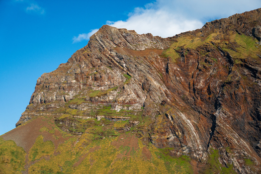 View of the rugged cliffs and geological strata of Hercules Bay South Georgia and the South Sandwich Islands. View of the rugged cliffs and geological strata of Hercules Bay South Georgia and the South Sandwich Islands.