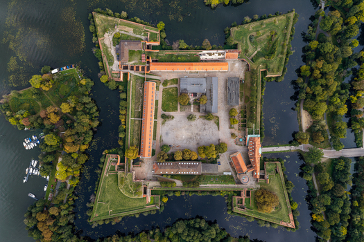 Aerial view of Spandau Citadel a historic star shaped fortress surrounded by a moat and lush parkland in Berlin Berlin Germany.