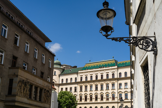 View of historic buildings with ornate facades and a traditional street lamp under a clear blue sky in Bratislava Bratislava Region Slovakia. View of historic buildings with ornate facades and a traditional street lamp under a clear blue sky in Bratislava Bratislava Region Slovakia.
