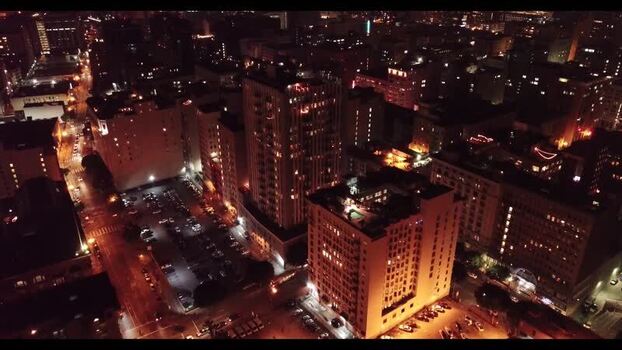 Aerial view of illuminated city buildings at night United States. Aerial view of illuminated city buildings at night United States.