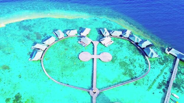Aerial view of overwater bungalows in Karimunjawa Indonesia. Aerial view of overwater bungalows in Karimunjawa Indonesia.