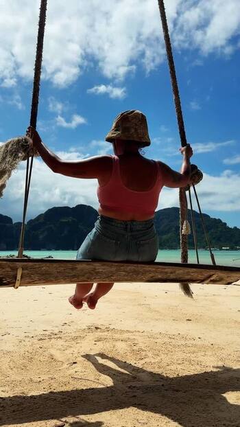 View of a person on a beach swing Thailand.