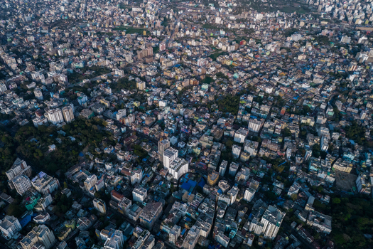 Chattogram Bangladesh 25 February 2022 Aerial view of the dense urban cityscape of Chattogram featuring a vast expanse of residential and commercial buildings and rooftops.